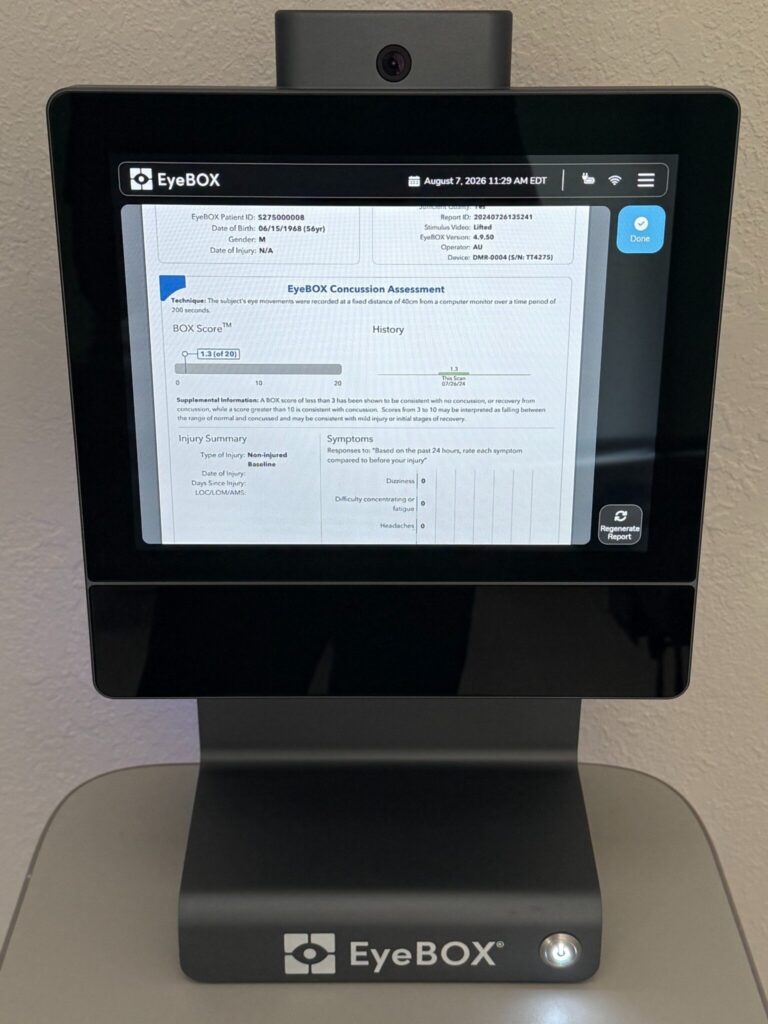 The EyeBOX eye-tracking concussion assessment device at TriMed Spine & Joint in Boca Raton, displaying a baseline BOX Score report