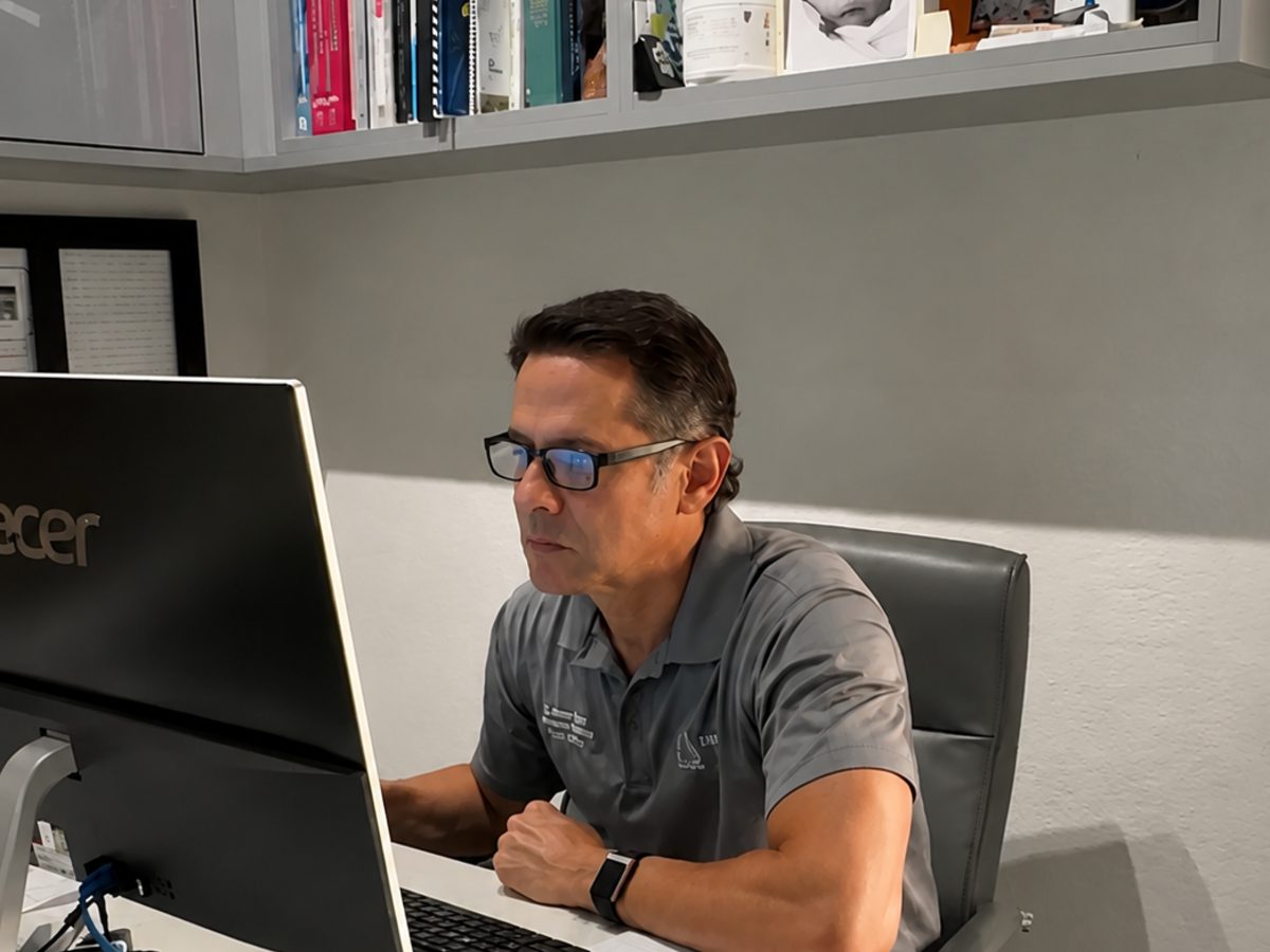 Dr. Steven Cantor reviewing a patient nutrition and supplement plan at TriMed Spine & Joint in Boca Raton